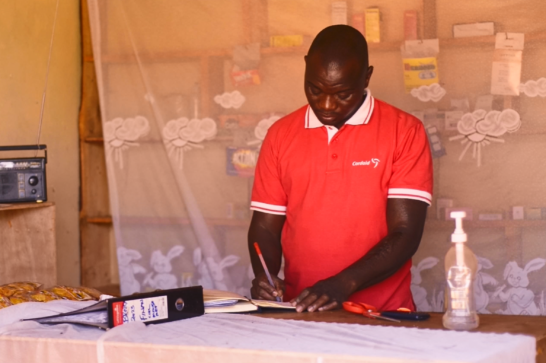 A shop owner in Uganda.