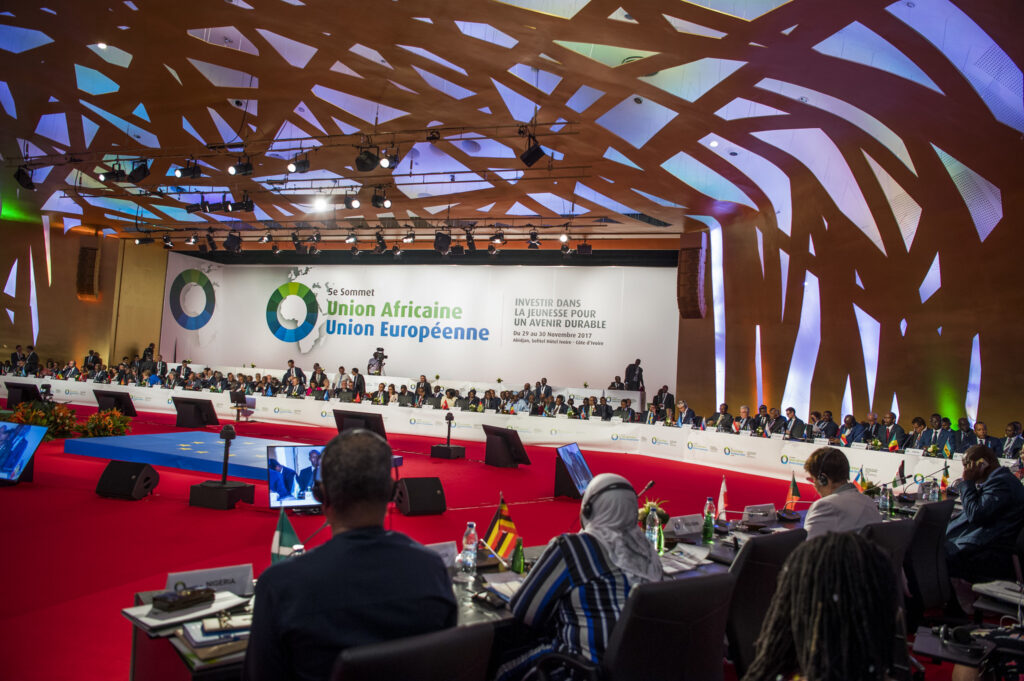 African and European ministers in a meeting room.