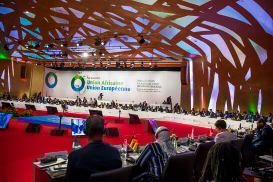 African and European ministers in a meeting room.