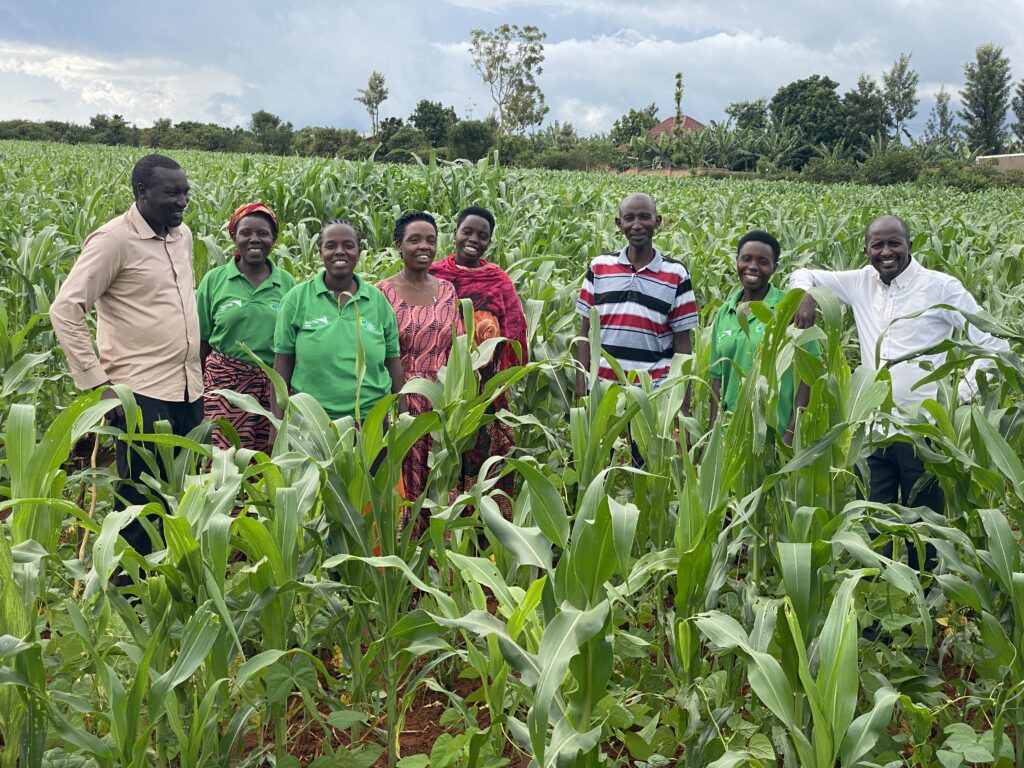 Rwandan farmers posing in their field.