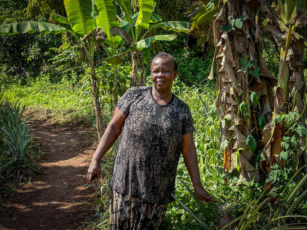 Woman standing in a lush green environment