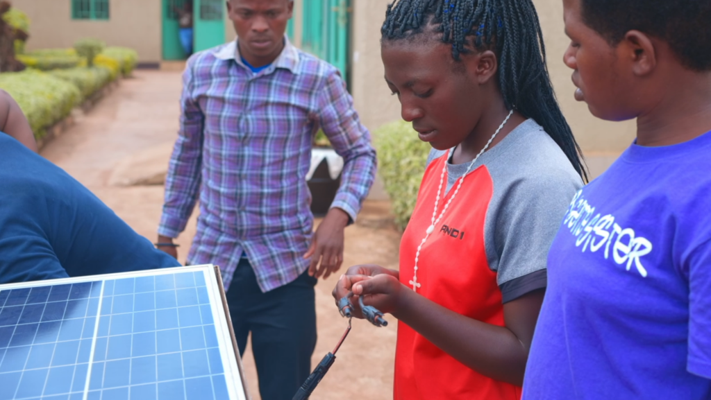 Youth participants of the STARLIT project in the Kayonza District in Rwanda, demonstrating solar-powered irrigation systems. 