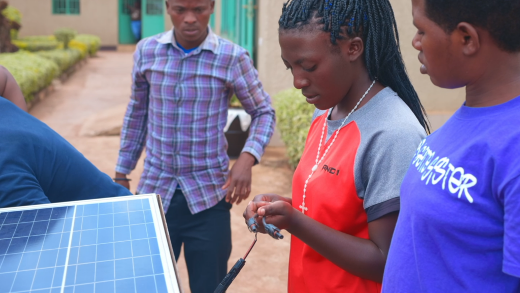 Youth participants of the STARLIT project in the Kayonza District in Rwanda, demonstrating solar-powered irrigation systems.