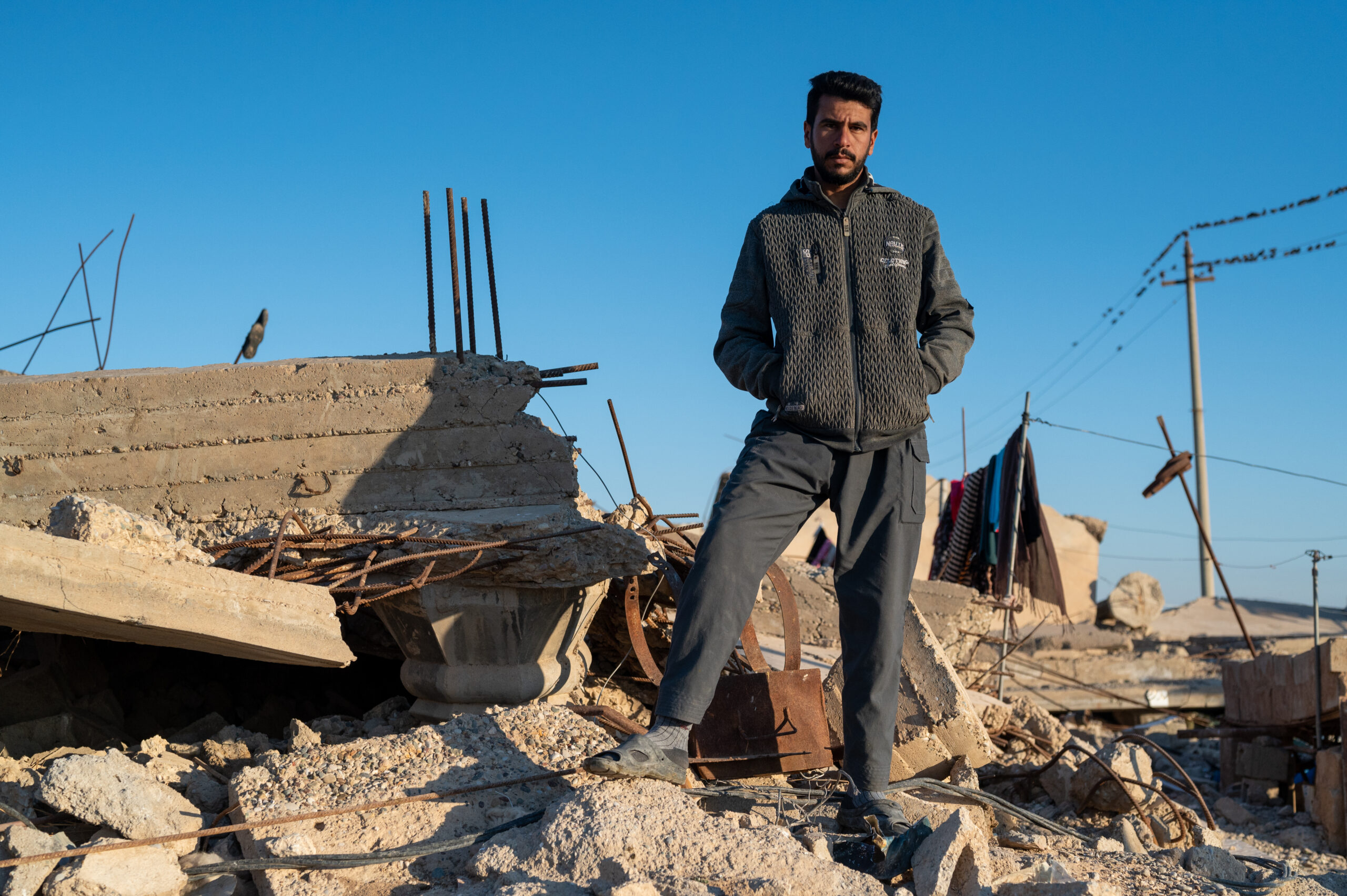 man on pile of rubble