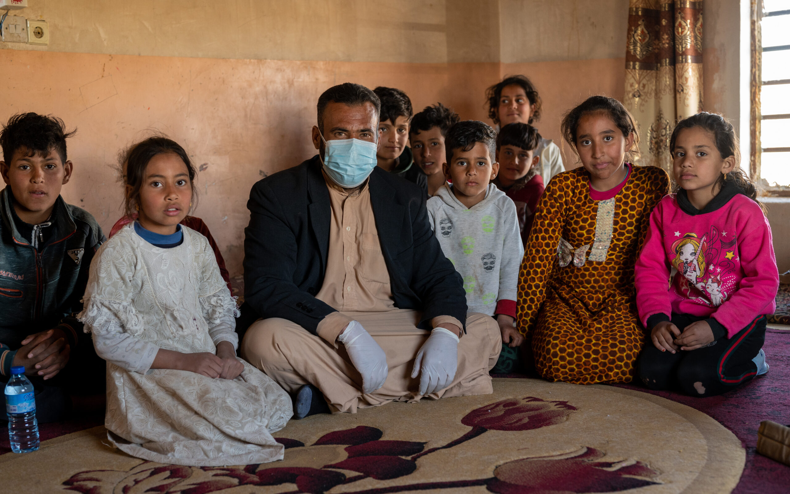 man and children inside a room