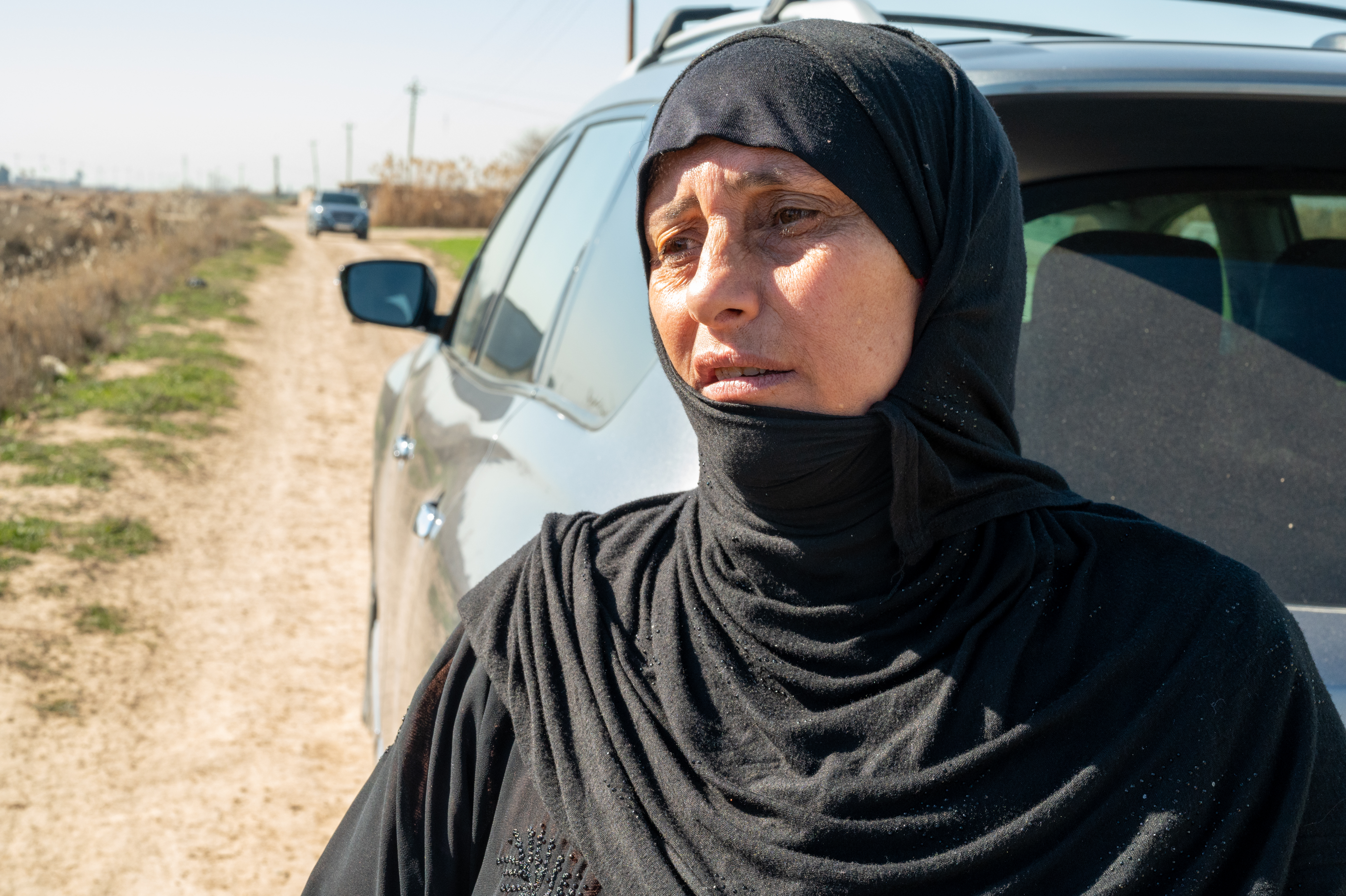 woman next to car