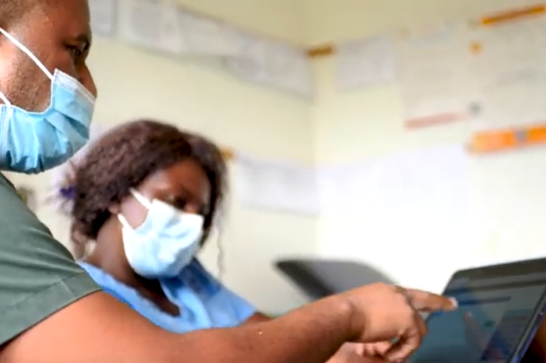 Health workers in Zimbabwe using the Electronic Health Records Information system.