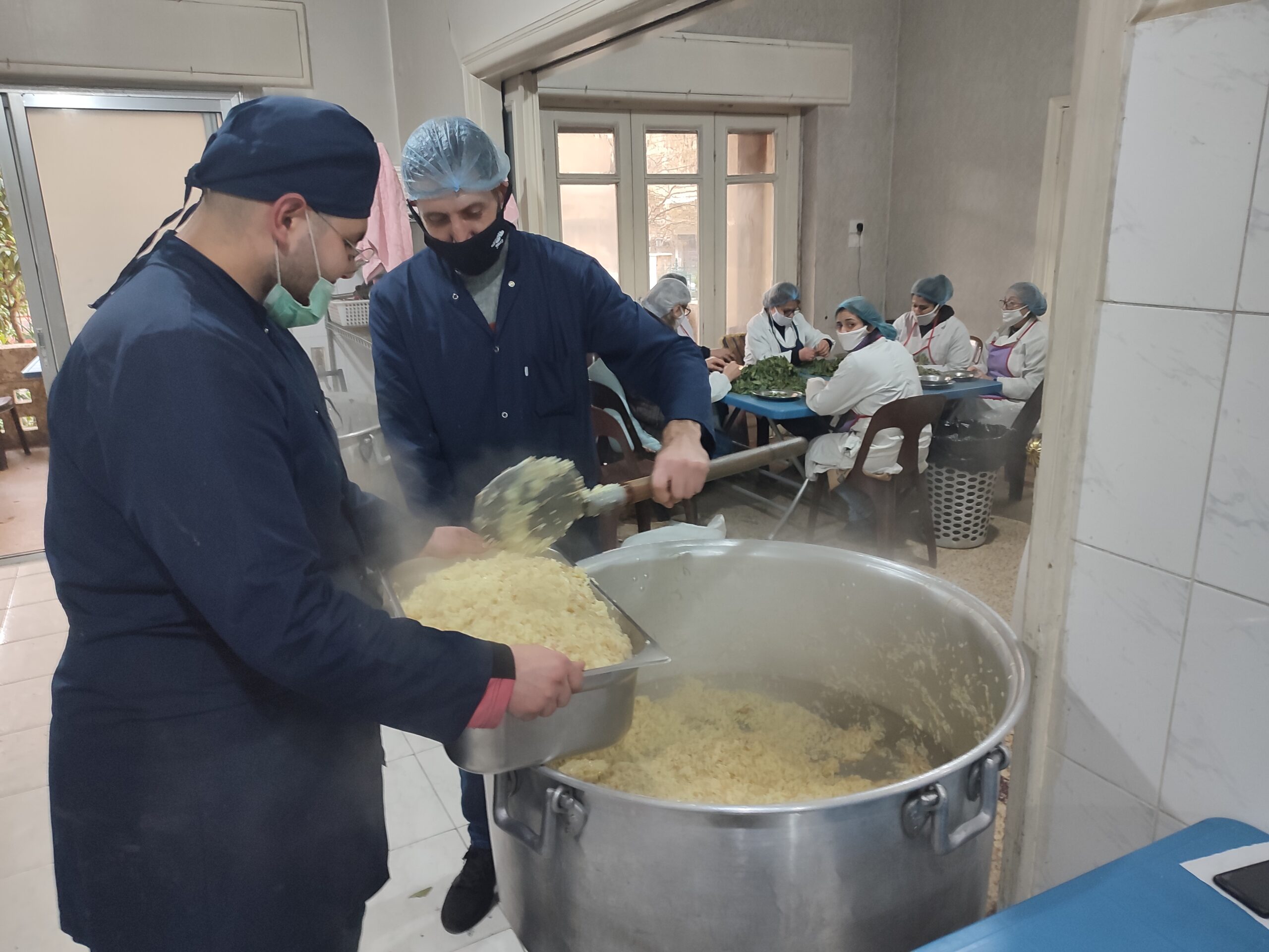 people in a kitchen