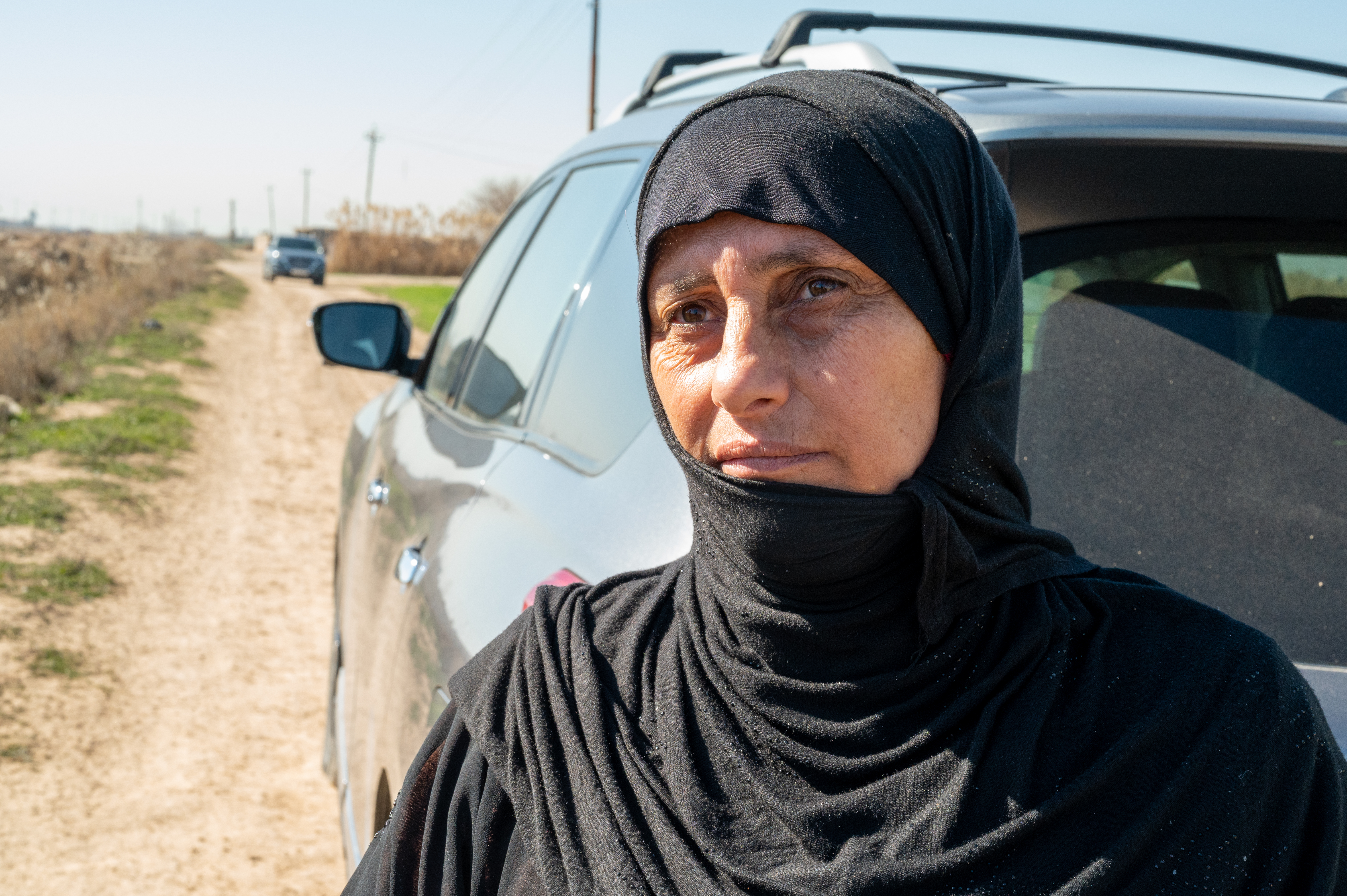 woman next to car 