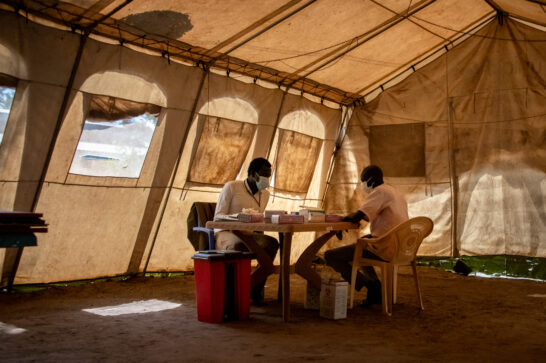 A doctor and a patient in a medical tent in South Sudan.