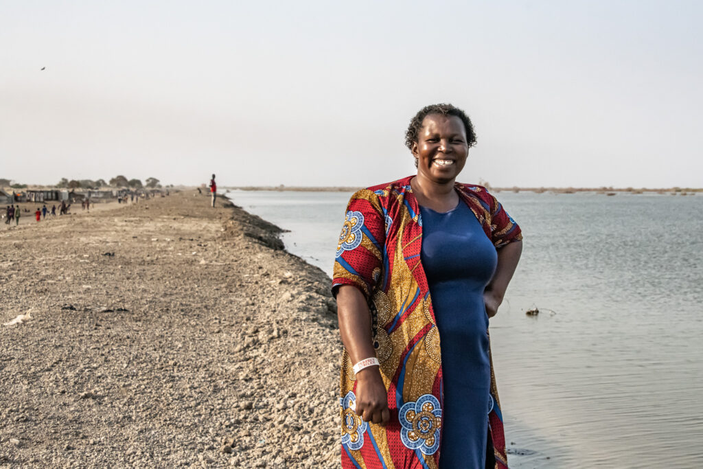 A woman on a dike in South Sudan.