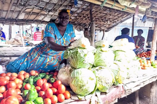 woman with vegetables in market