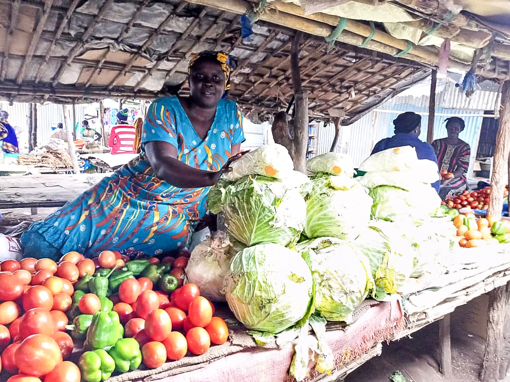 woman with vegetables in market