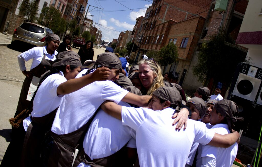 Group hug in a street in La Paz, Bolivia