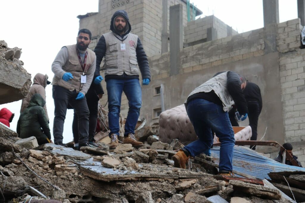 Syrian aid workers in an earthquake disaster area.