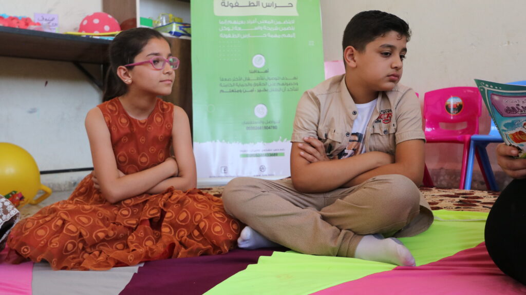 Two Syrian school kids in a classroom.