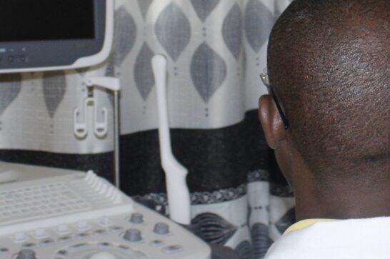 A doctor performing an ultrasound in a Burundian hospital.